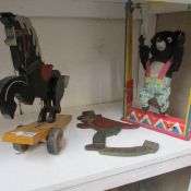 A bear acrobat and wooden toys