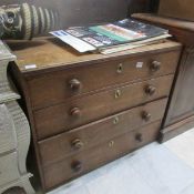 An oak 4 drawer chest
