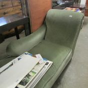 A green chaise longue