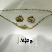 A 9ct gold necklace and earrings set peridot