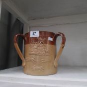 A stoneware loving cup, a/f