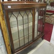 An oak astragal glazed display cabinet