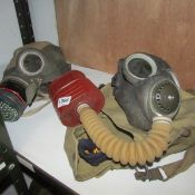 2 gas masks with cases