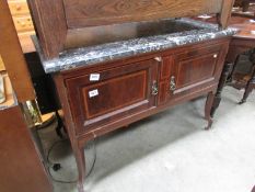 An inlaid washstand with marble top