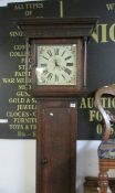 A mahogany long case clock with painted face