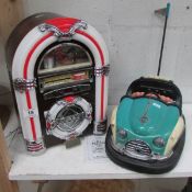 A novelty Dodgem cassette player and Wurlitzer juke box CD/radio