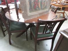 A mahogany dining table and 6 chairs