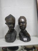 2 carved busts of African natives
