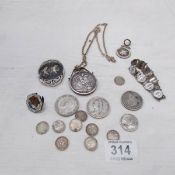 A mixed lot of silver including coins and bracelet