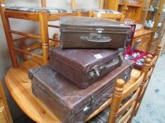 3 old leather suitcases