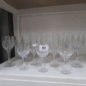 A quantity of cut glass wine glasses