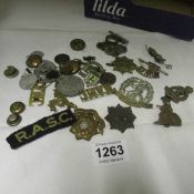 A quantity of British military badges and others