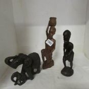 2 wooden figures and a soapstone elephant