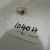 A 9ct gold ring set central heart stone