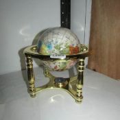 A jewelled table globe incorporating compass