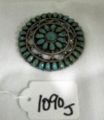 A silver brooch set turquoise marked LMB