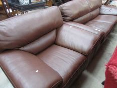 A brown leather sofa and chair