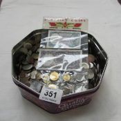A large tin of mostly Foreign coins