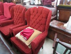 A pair of wing armchairs