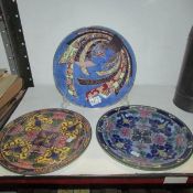 A pair of Doulton plates and one other