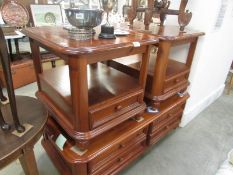 A drawer base coffee table and matching side tables