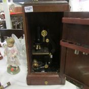 A Watson and glover cased microscope