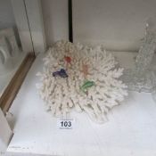 A piece of coral with glass fish