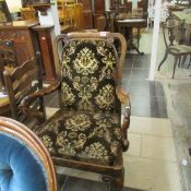 A Victorian walnut ball and claw Queen Anne style chair