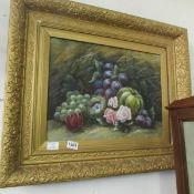 A gilt framed still life oil on canvas of fruit, signed