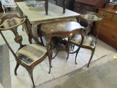 A pair of inlaid chairs and an inlaid table