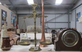 A mantel clock, brass scales and pewter lidded jug