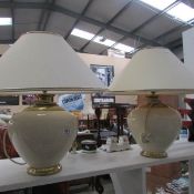 A pair of table lamps with shades