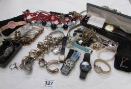 A mixed lot of costume jewellery and watches