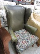 A Parker Knoll wing armchair, a/f