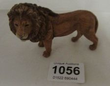 A cold painted bronze lion