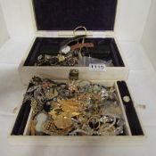 A jewellery box with jewellery and watches