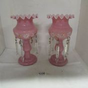 A pair of pink lustre vases and droppers (2 droppers missing parts)