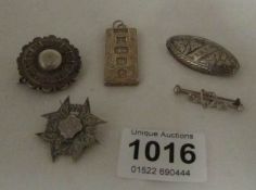 4 silver brooches and a silver ingot (45gms)