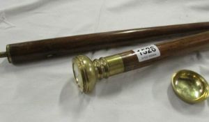 A walking stick with watch in handle