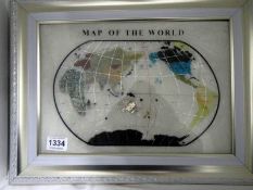 A framed Gemstone set map of the world in case