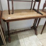 A Victorian stretcher base table