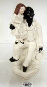 A Staffordshire 'Uncle Tom' figure