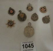 6 silver watch fobs, a silver cyclist medal and a compass