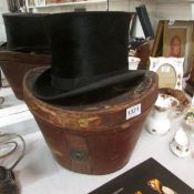 A silk top hat in leather hat box, a/f