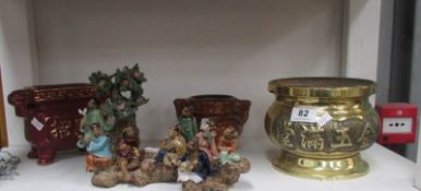 An Oriental brass pot, 2 others and a figure group