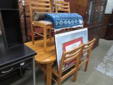 A pine kitchen table and 4 chairs