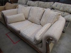 A wood framed 2 seat sofa