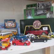 A quantity of boxed and unboxed diecast cars including Corgi Professionals