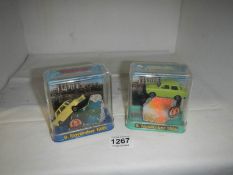 2 boxed fragments of the Berlin wall with diecast Trabant cars dated 9th November 1989