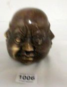A brass 4 faced Buddha head (12cm)